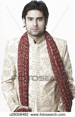 Stock Image - Portrait of a young man in traditional clothing. Fotosearch