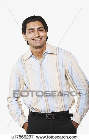 Stock Photo - Portrait of a young man with his hands in his pockets. Fotosearch