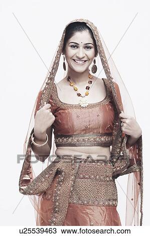 Portrait of a young woman in traditional clothing smiling View Large Photo Image Stock Image - Portrait of a young woman in traditional clothing smiling. Fotosearch
