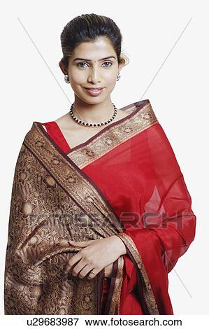 Portrait of a young woman wearing a sari View Large Photo Image Stock Photo - Portrait of a young woman wearing a sari. Fotosearch