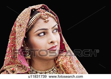 Stock Photo - Close-up of a bride in a traditional wedding dress. Fotosearch