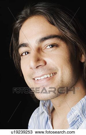Portrait of a young man smiling View Large Photo Image Stock Image - Portrait of a young man smiling. Fotosearch