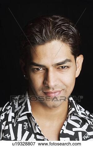 Stock Photo - Portrait of a young man smiling. Fotosearch