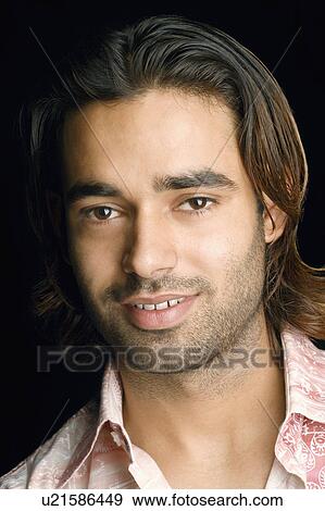 Portrait of a young man smiling View Large Photo Image Stock Photo - Portrait of a young man smiling. Fotosearch