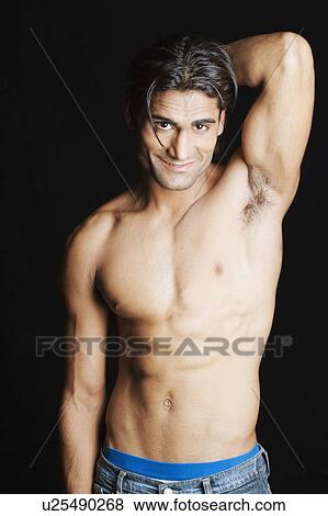 Portrait of a young man smiling View Large Photo Image Stock Photo - Portrait of a young man smiling. Fotosearch
