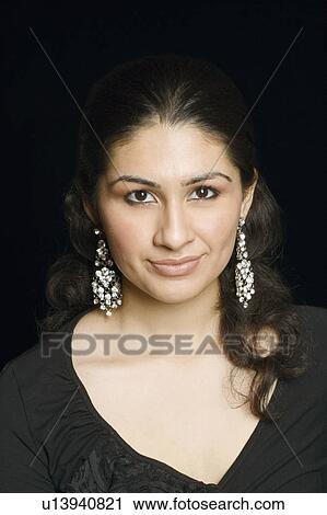 Stock Image - Portrait of a young woman grinning. Fotosearch