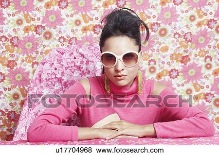 Close-up of a young woman with her hands clasped View Large Photo Image Stock Photo - Close-up of a young woman with her hands clasped. Fotosearch