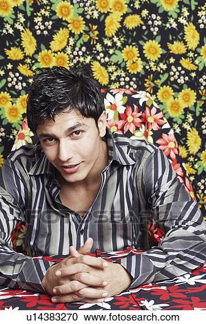 Stock Image - Portrait of a young man smiling. Fotosearch