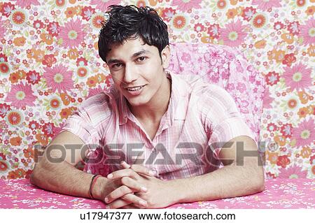 Stock Photo - Portrait of a young man smiling. Fotosearch