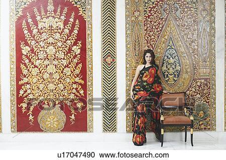Stock Image - Portrait of a young woman posing. Fotosearch