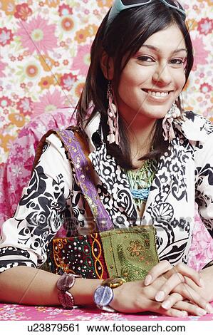 Stock Image - Portrait of a young woman smiling. Fotosearch
