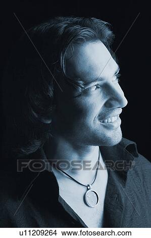 Picture - Close-up of a young man smiling. Fotosearch