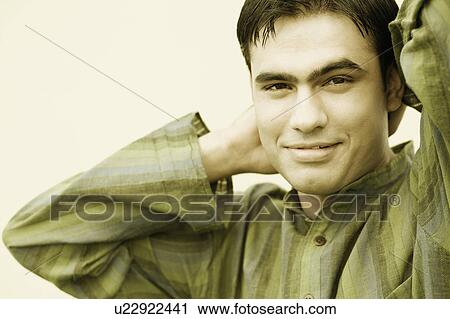 Stock Image - Close-up of a young man smiling. Fotosearch