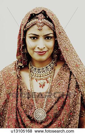 Stock Photo - Portrait of a bride in a traditional wedding dress. Fotosearch