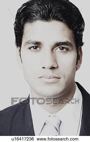 Stock Photograph - Portrait of a businessman looking serious. Fotosearch