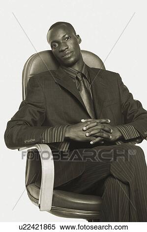 Portrait of a businessman with his hands clasped View Large Photo Image Stock Photography - Portrait of a businessman with his hands clasped. Fotosearch
