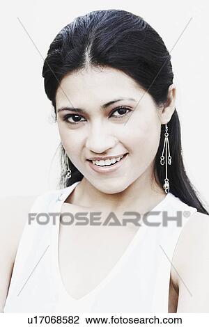 Stock Image - Portrait of a young woman smiling. Fotosearch