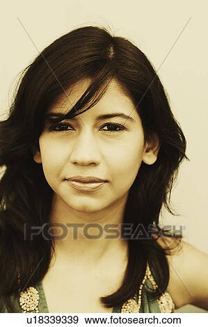 Stock Photo - Portrait of a young woman thinking. Fotosearch