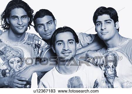 Stock Image - Portrait of four young men smiling. Fotosearch
