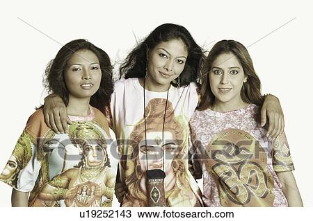 Stock Image - Portrait of three young women standing together. Fotosearch