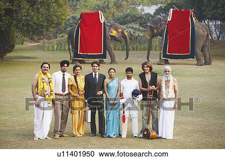 Stock Image - Group of people standing in the garden. Fotosearch