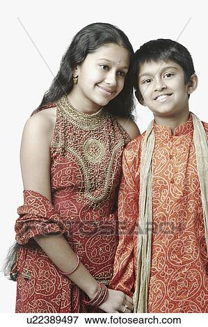 Stock Photo - Portrait of a boy and his sister smiling. Fotosearch