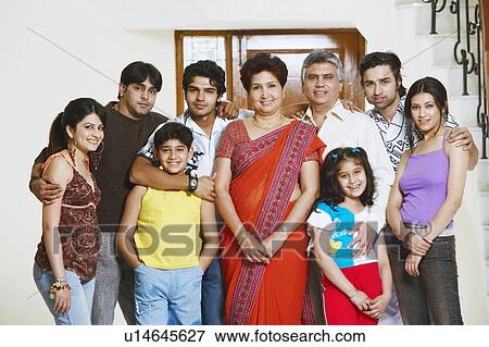 Portrait of a family standing together View Large Photo Image Stock Photo - Portrait of a family standing together. Fotosearch