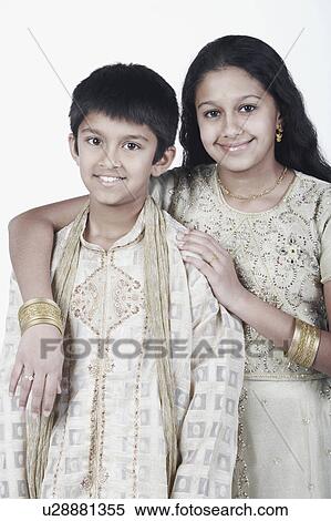 Portrait of a girl standing with her arm around her brother View Large Photo Image Stock Photography - Portrait of a girl standing with her arm around her brother. Fotosearch