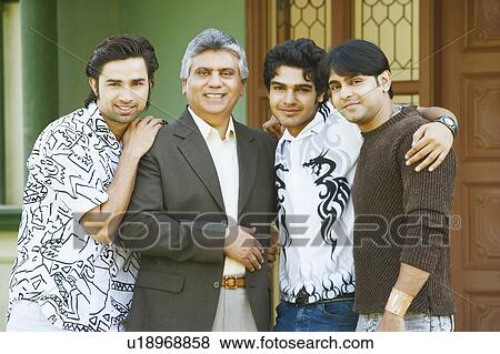 Portrait of a mature man and his three sons smiling View Large Photo Image Stock Photo - Portrait of a mature man and his three sons smiling. Fotosearch