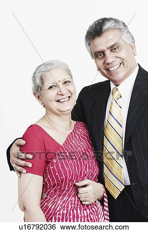 Stock Photograph - Portrait of a mature woman and her son. Fotosearch