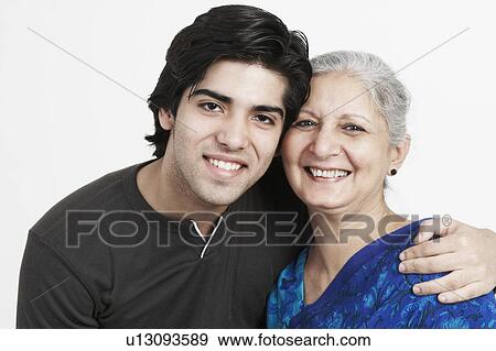 Stock Photo - Portrait of a mature woman and her grandson smiling. Fotosearch