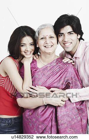 Portrait of a mature woman with her two grandchildren View Large Photo Image Stock Image - Portrait of a mature woman with her two grandchildren. Fotosearch