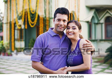 Portrait of a mid adult man with a young woman smiling View Large Photo Image Stock Image - Portrait of a mid adult man with a young woman smiling. Fotosearch