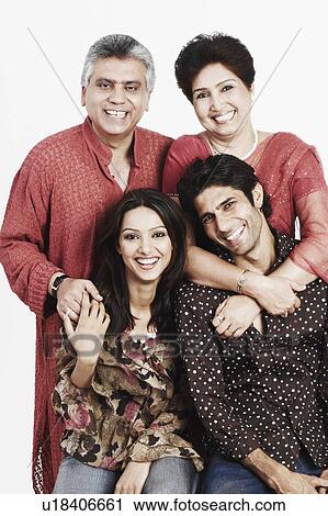 Portrait of parents and their two children smiling View Large Photo Image Stock Image - Portrait of parents and their two children smiling. Fotosearch