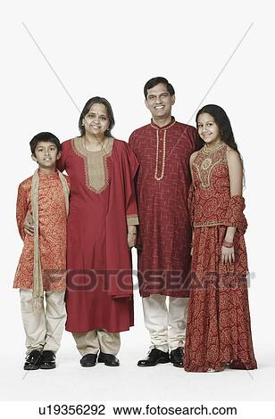 Stock Image - Portrait of parents standing with their son and daughter. Fotosearch