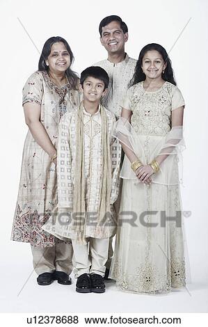 Portrait of parents standing with their son and daughter View Large Photo Image Stock Photo - Portrait of parents standing with their son and daughter. Fotosearch