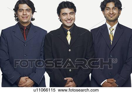 Portrait of three businessmen standing side by side and smiling View Large Photo Image Stock Photography - Portrait of three businessmen standing side by side and smiling. Fotosearch