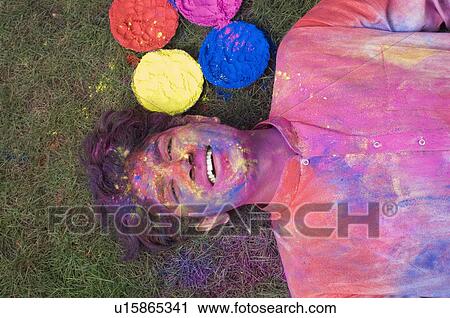 Portrait of a young man with powder paint on his face and smiling View Large Photo Image Stock Image - Portrait of a young man with powder paint on his face and smiling. Fotosearch