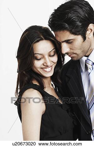 Stock Image - Close-up of a businessman with a businesswoman. Fotosearch