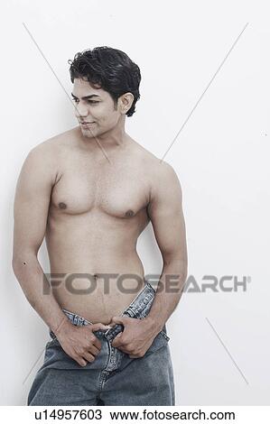Close-up of a young man posing View Large Photo Image Stock Image - Close-up of a young man posing. Fotosearch