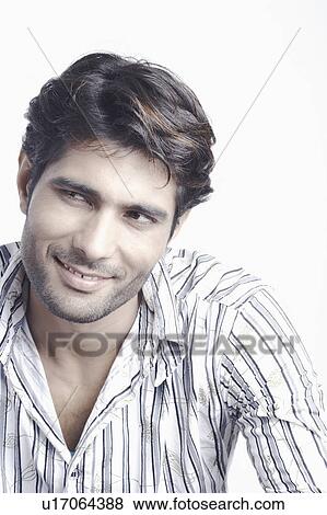 Stock Photo - Close-up of a young man smiling. Fotosearch