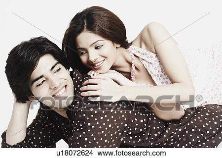 Close-up of a young woman lying on a young man's back View Large Photo Image Picture - Close-up of a young woman lying on a young man's back. Fotosearch
