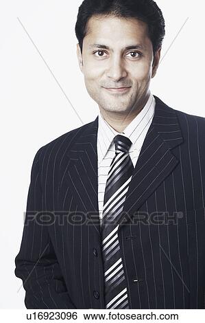 Portrait of a businessman grinning View Large Photo Image Stock Photograph - Portrait of a businessman grinning. Fotosearch