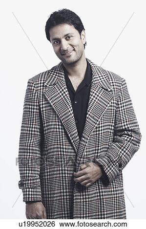 Stock Photograph - Portrait of a mid adult man smiling. Fotosearch