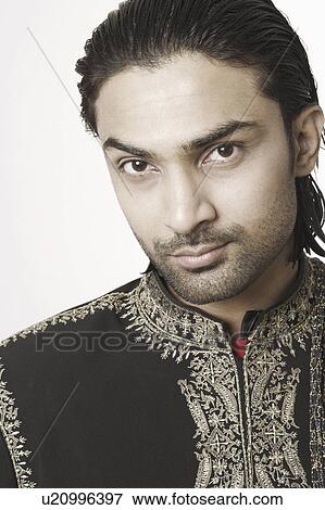 Portrait of a young man in traditional clothing View Large Photo Image Stock Photo - Portrait of a young man in traditional clothing. Fotosearch
