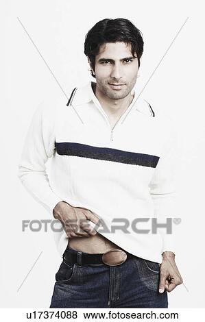 Portrait of a young man posing View Large Photo Image Stock Photo - Portrait of a young man posing. Fotosearch