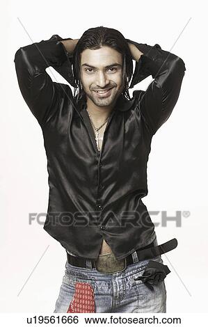 Portrait of a young man posing View Large Photo Image Stock Photograph - Portrait of a young man posing. Fotosearch