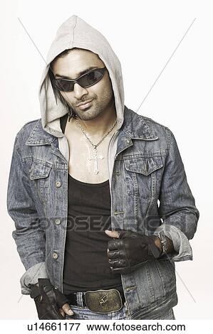 Portrait of a young man wearing a hooded shirt View Large Photo Image Stock Photo - Portrait of a young man wearing a hooded shirt. Fotosearch