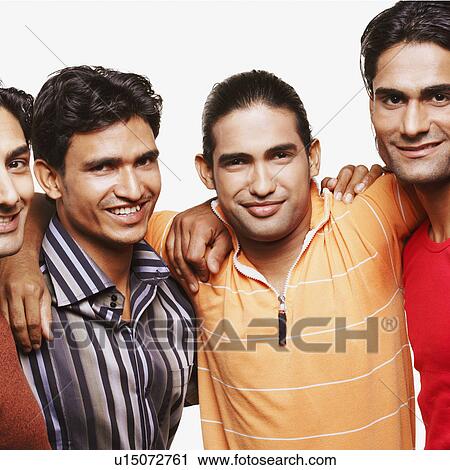 Portrait of four young men with their arms around each other and smiling View Large Photo Image Stock Image - Portrait of four young men with their arms around each other and smiling. Fotosearch