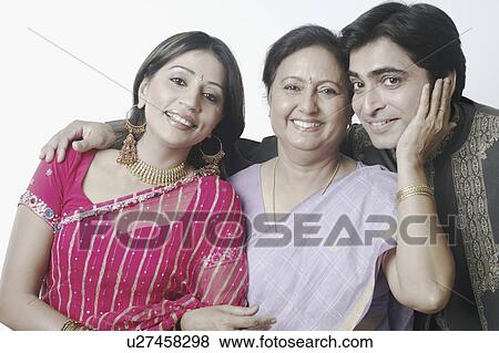 Portrait of a mid adult couple and a mature woman smiling View Large Photo Image Stock Photo - Portrait of a mid adult couple and a mature woman smiling. Fotosearch